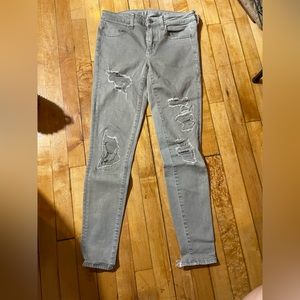 American Eagle Sage green distressed skinny jeans